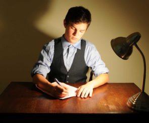 Teen writing a letter